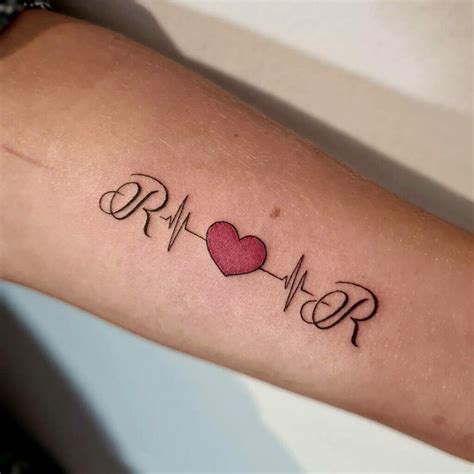 heartbeat with name tattoo